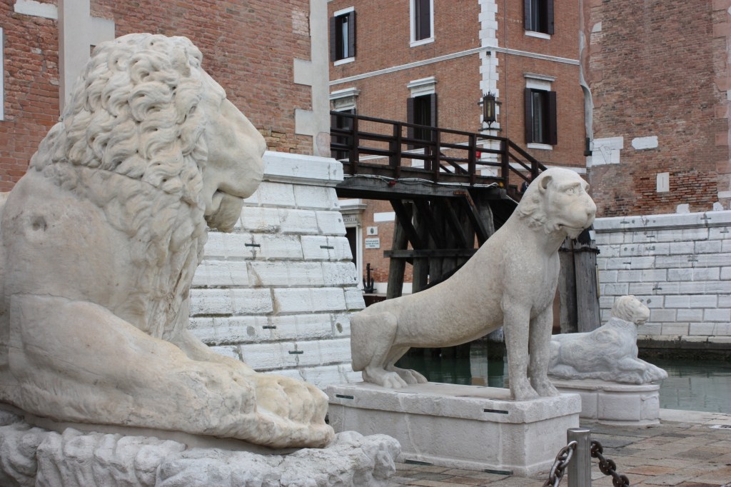 An original Delos lion (with a later head) flanked by another Greek big cat and a ‘lion dog’ outside the main gate to the Arsenale in Venice, Italy